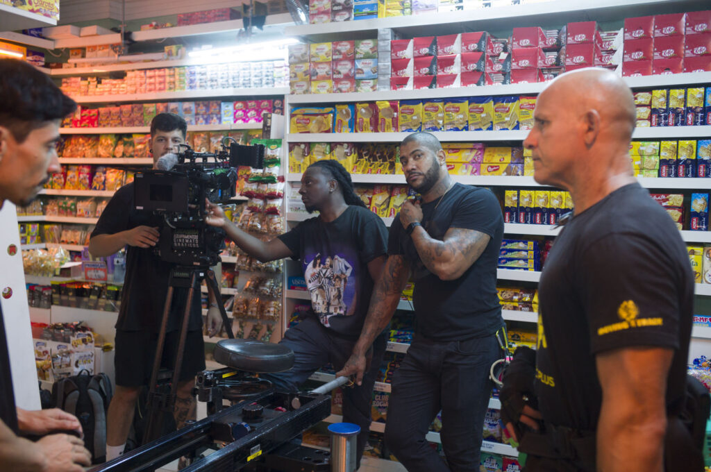 Video production crew setting up camera in a convenience store